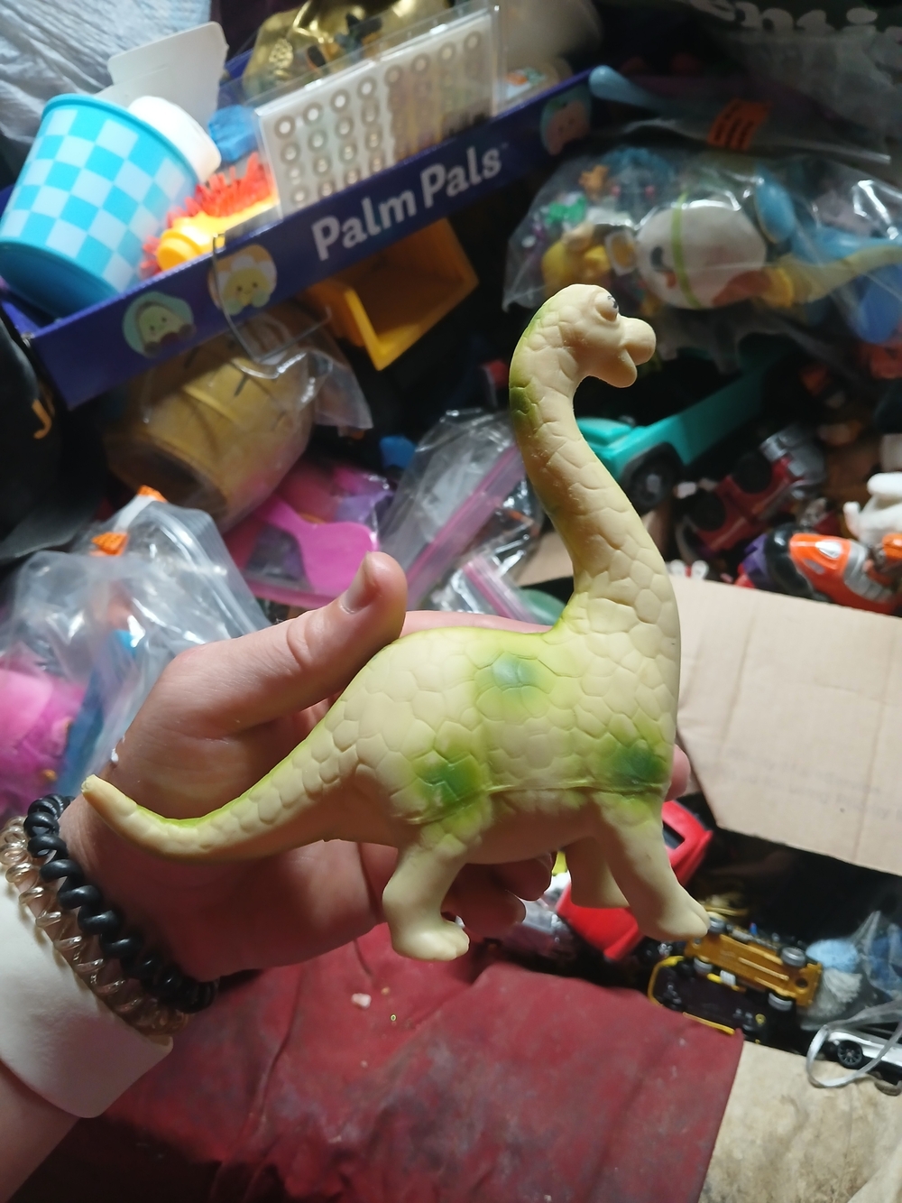 vintage soft rubber or plastic cartoon-style long-necked dinosaur toy
